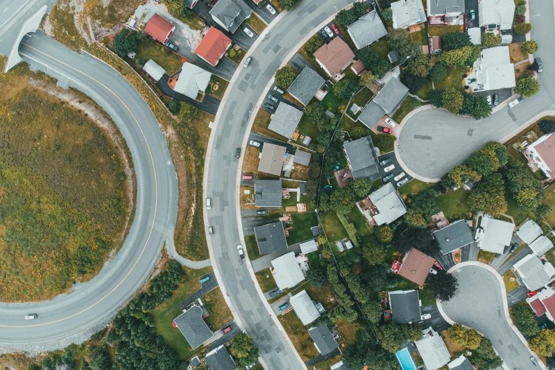 Home 15 Aerial view of a suburban neighborhood with curved roads and 1779210070